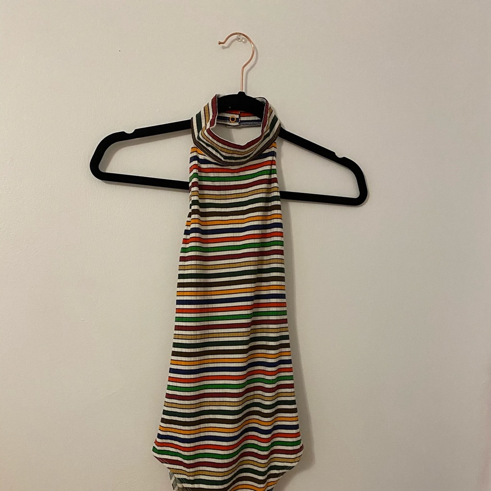 Stripped, tight body suit with open back